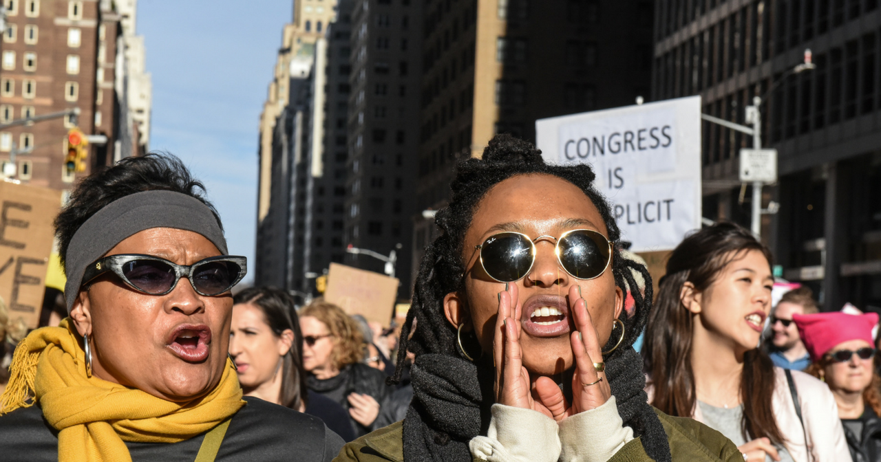 Black women yell at a protest