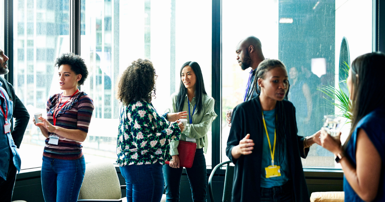 A diverse group of people discuss new ideas