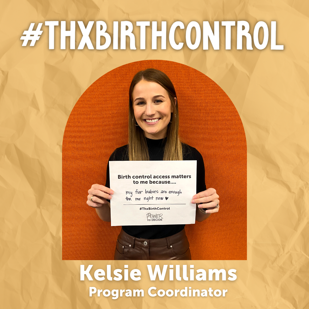 A Power to Decide Staffer holds a sign with their reason for saying #ThxBirthControl.