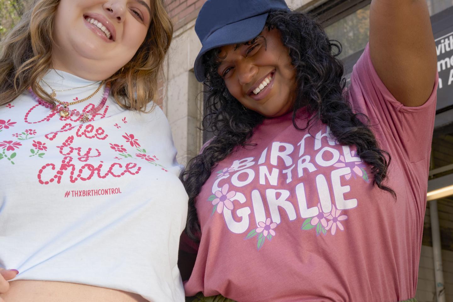 Two happy women wearing shirts celebrating birth control. 