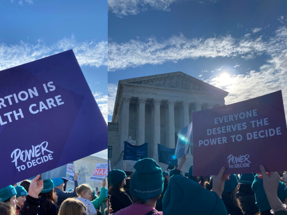 People holding Power to Decide's signs at the #MyRightMyDecision rally. 