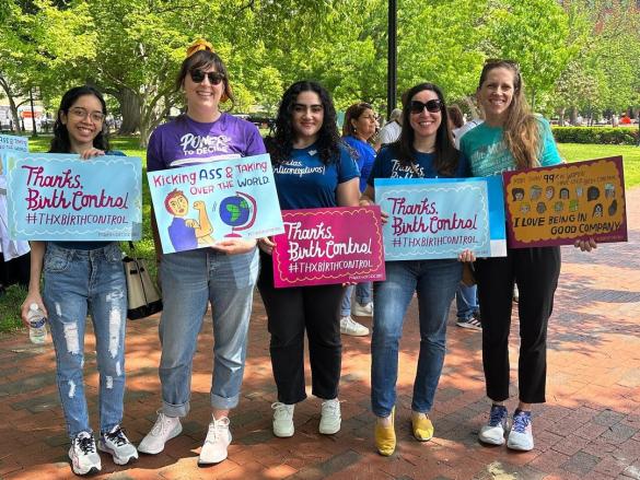 A group of Power to Decide staff hold signs that say "Thanks, Birth Control"